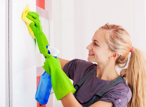 Technician preparing carpet cleaning equipment with safety focus