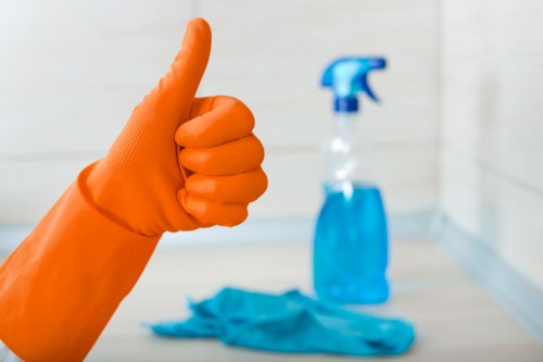 Office cleaning team maintaining shared kitchen and washroom areas